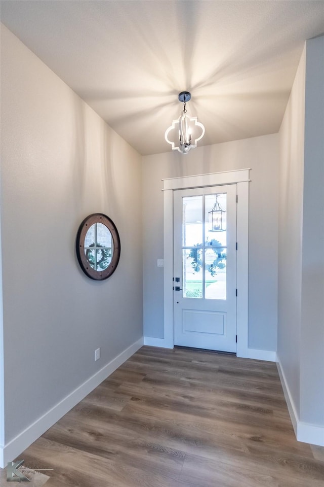 3342 Torrey Pne, Abilene, TX 79606 - entryway with a chandelier, baseboards, and dark wood-type flooring