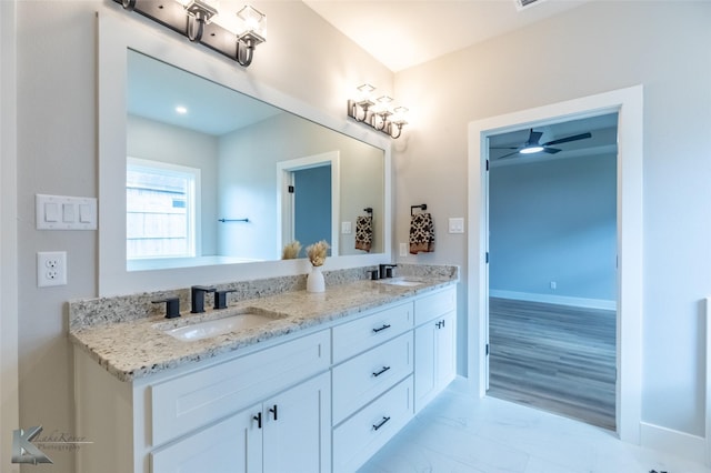 3342 Torrey Pne, Abilene, TX 79606 - bathroom featuring a ceiling fan, marble finish floor, double vanity, and a sink