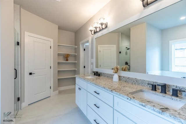 3342 Torrey Pne, Abilene, TX 79606 - bathroom featuring a shower stall, double vanity, and a sink