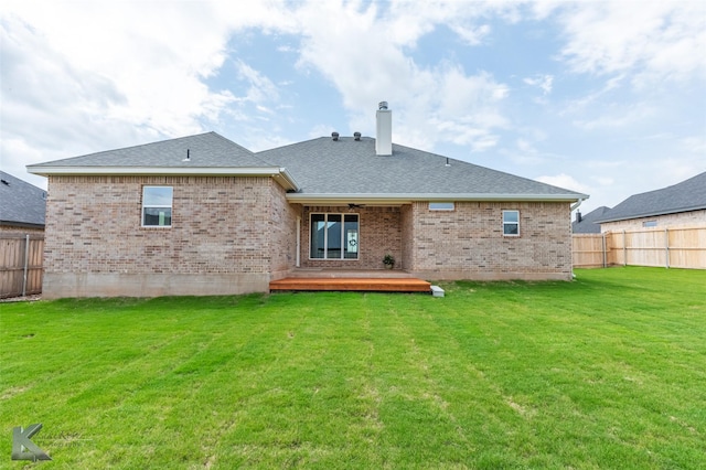 3342 Torrey Pne, Abilene, TX 79606 - rear view of house with fence, brick siding, a deck, a chimney, and a yard