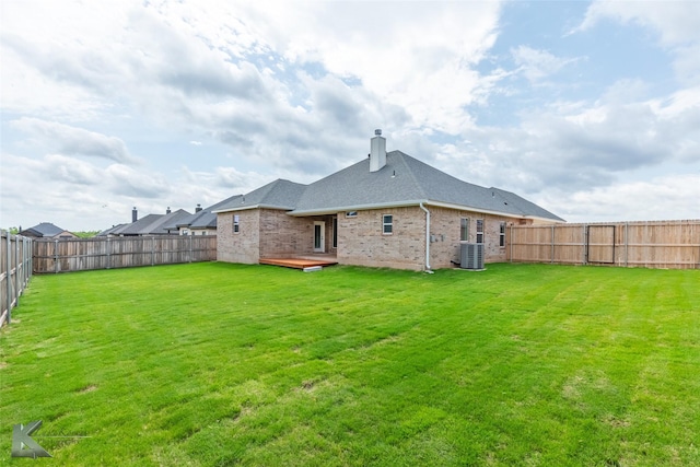 3342 Torrey Pne, Abilene, TX 79606 - rear view of house featuring a fenced backyard, a chimney, brick siding, central AC unit, and a lawn