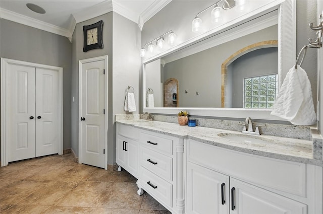 full bathroom with a sink, double vanity, and ornamental molding