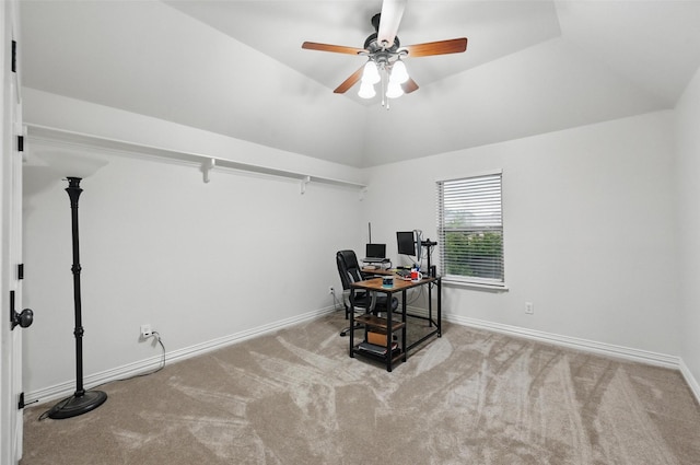 carpeted home office with baseboards, lofted ceiling, and ceiling fan
