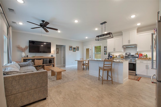 kitchen featuring under cabinet range hood, ornamental molding, open floor plan, and electric stove