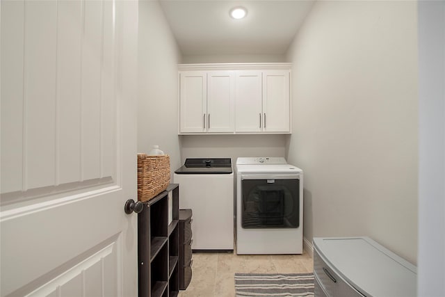 laundry area with cabinet space and washer and clothes dryer