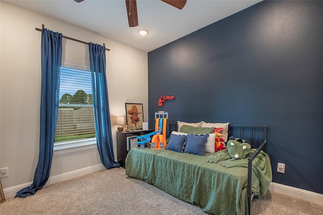bedroom with baseboards, a ceiling fan, and carpet