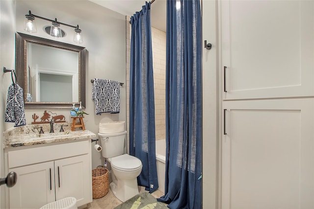 bathroom featuring tile patterned floors, toilet, shower / bath combo, and vanity