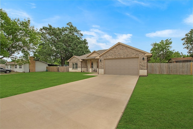 ranch-style house featuring fence, a garage, a front lawn, and brick siding