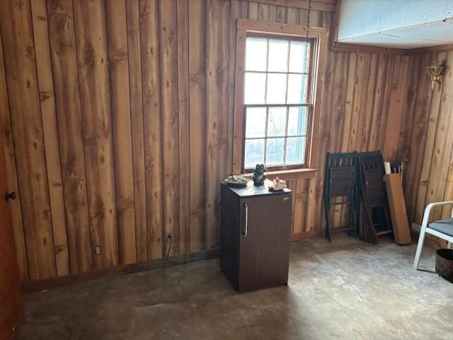 interior space with a wealth of natural light and wood walls