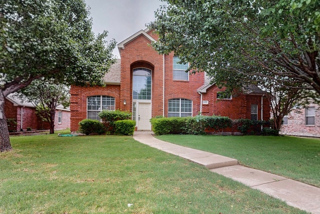 3405 Longneedle Ln, Mckinney, TX 75070 - traditional-style house with brick siding and a front lawn