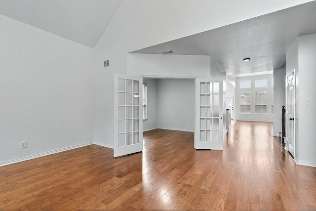 3405 Longneedle Ln, Mckinney, TX 75070 - interior space featuring french doors, visible vents, and wood finished floors
