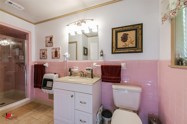 1020 Machen Dr, Springhill, LA 71075 - bathroom with tile walls, tile patterned floors, heating unit, a shower stall, and vanity