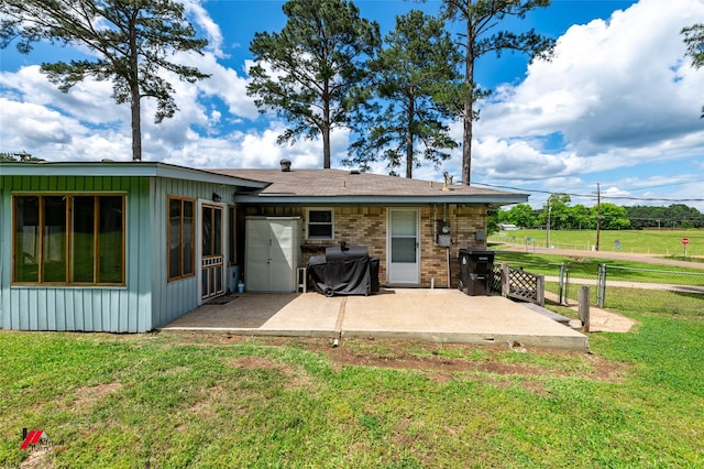 1020 Machen Dr, Springhill, LA 71075 - back of property with a patio, board and batten siding, and brick siding