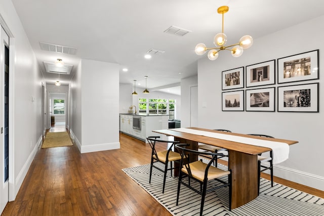 8831 Lanarkshire Dr, Dallas, TX 75238 - dining space with wood finished floors, baseboards, attic access, a chandelier, and recessed lighting