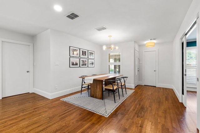 8831 Lanarkshire Dr, Dallas, TX 75238 - dining space with wood finished floors, a chandelier, healthy amount of natural light, and baseboards