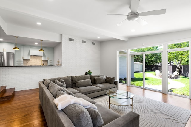 8831 Lanarkshire Dr, Dallas, TX 75238 - living room featuring brick wall, dark wood-style floors, a ceiling fan, beam ceiling, and recessed lighting