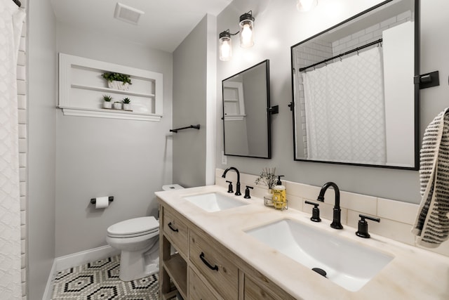 8831 Lanarkshire Dr, Dallas, TX 75238 - bathroom featuring double vanity, toilet, tile patterned flooring, baseboards, and a shower with shower curtain