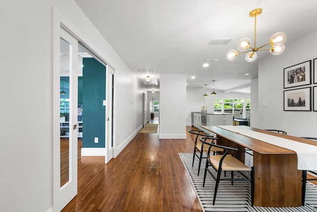 8831 Lanarkshire Dr, Dallas, TX 75238 - dining space with hardwood / wood-style flooring, baseboards, a chandelier, and recessed lighting