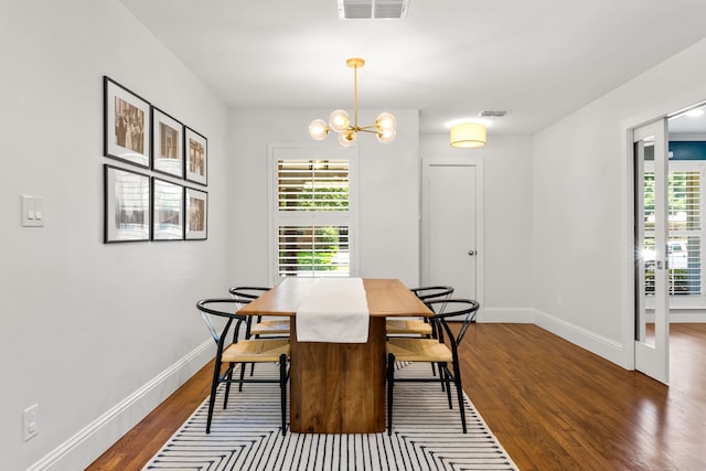 8831 Lanarkshire Dr, Dallas, TX 75238 - dining space featuring dark wood finished floors, baseboards, and a chandelier