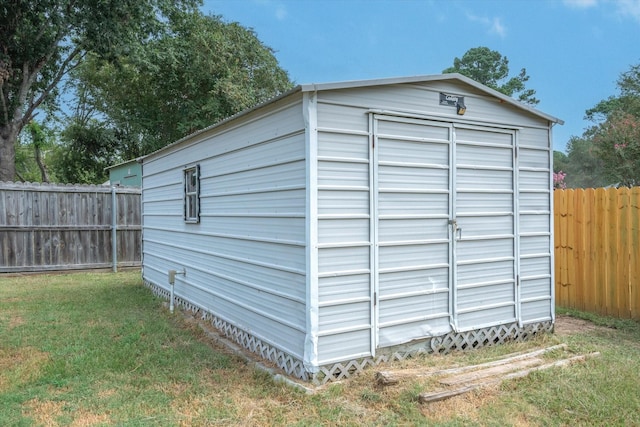 view of shed with a fenced backyard
