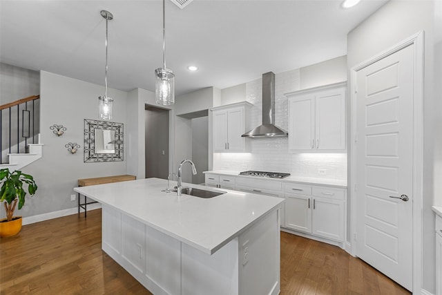 2472 Bainbridge Dr, Allen, TX 75013 - kitchen with a sink, wall chimney exhaust hood, stainless steel gas stovetop, dark wood-type flooring, and tasteful backsplash