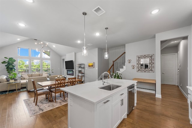 2472 Bainbridge Dr, Allen, TX 75013 - kitchen with a sink, open floor plan, stainless steel dishwasher, a kitchen island with sink, and light countertops