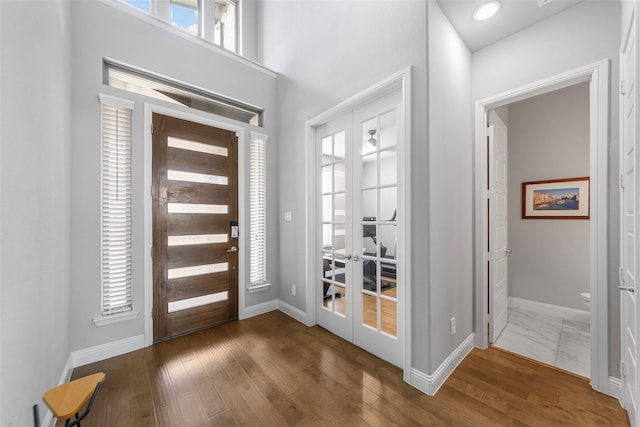 2472 Bainbridge Dr, Allen, TX 75013 - foyer entrance featuring french doors, wood finished floors, and baseboards