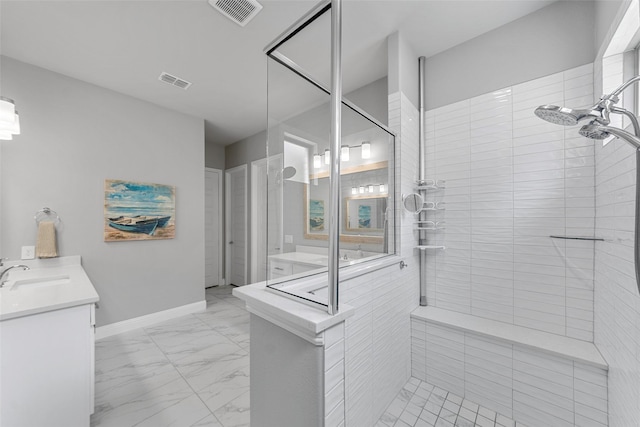 2472 Bainbridge Dr, Allen, TX 75013 - full bathroom featuring marble look tiles, tiled shower, vanity, and baseboards
