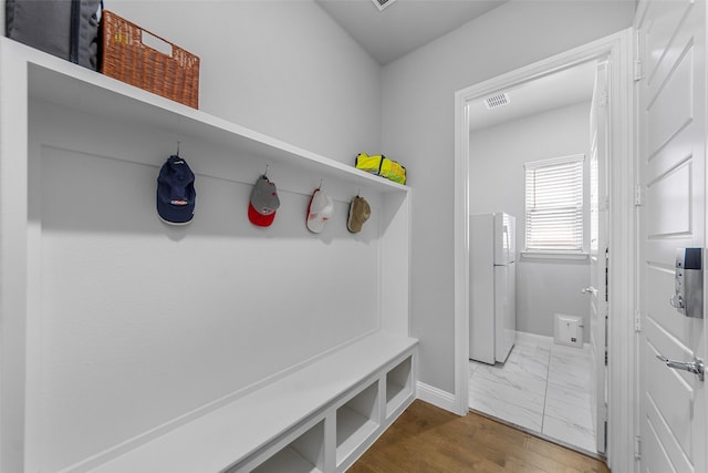 2472 Bainbridge Dr, Allen, TX 75013 - mudroom featuring baseboards and marble look tile flooring