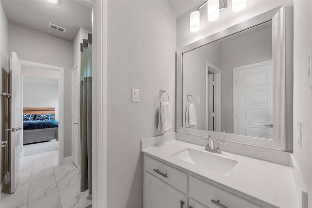 2472 Bainbridge Dr, Allen, TX 75013 - full bath featuring marble finish floors, vanity, ensuite bathroom, and baseboards