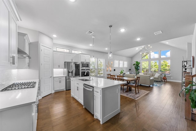 2472 Bainbridge Dr, Allen, TX 75013 - kitchen featuring appliances with stainless steel finishes, light countertops, plenty of natural light, open floor plan, and recessed lighting