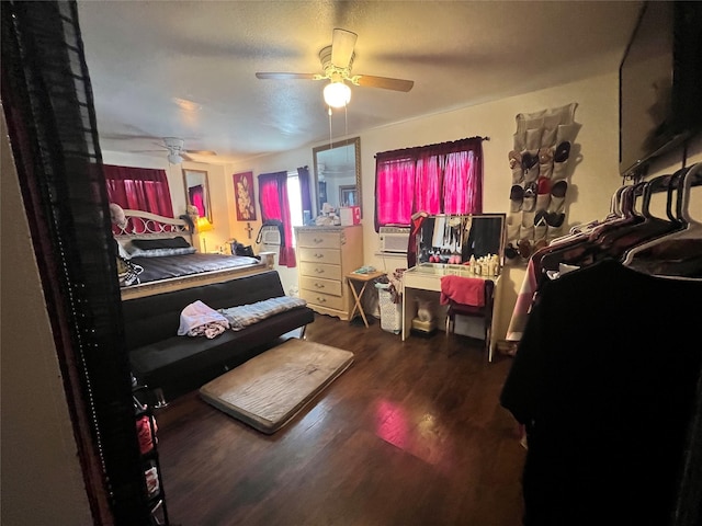 bedroom with wood finished floors and ceiling fan