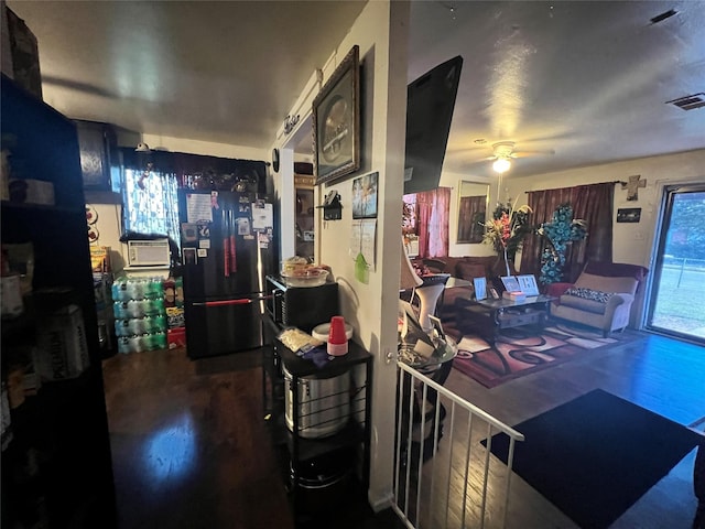 interior space featuring ceiling fan and visible vents