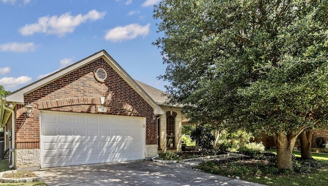 24 Tallwood Ln, Edgecliff Village, TX 76134 - view of front of house with a garage, driveway, brick siding, and stone siding