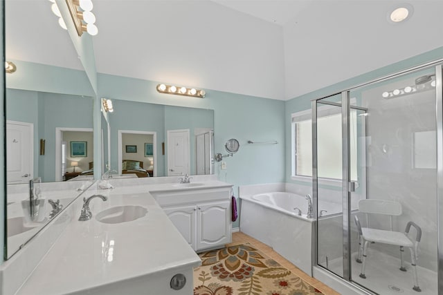 24 Tallwood Ln, Edgecliff Village, TX 76134 - ensuite bathroom with a garden tub, double vanity, a shower stall, a towering ceiling, and tile patterned flooring
