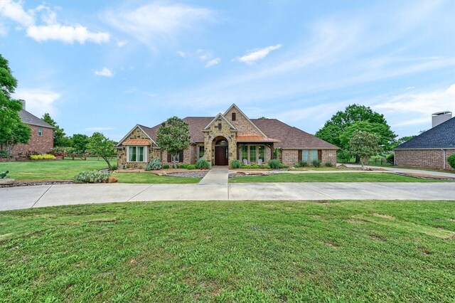 1421 Rolling, Celina, TX 75009 - doorway to property featuring brick siding and stone siding