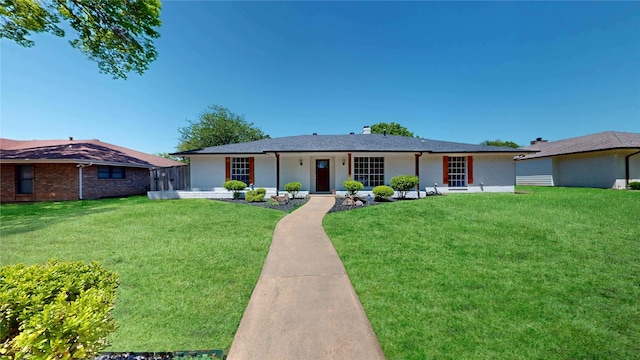 single story home featuring a front yard and brick siding