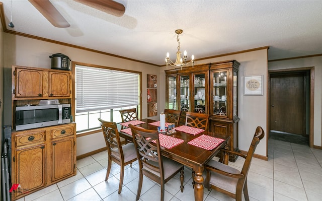 171 Columbia Road 84, Magnolia, AR 71753 - dining space featuring a chandelier, light tile patterned flooring, baseboards, ornamental molding, and a textured ceiling