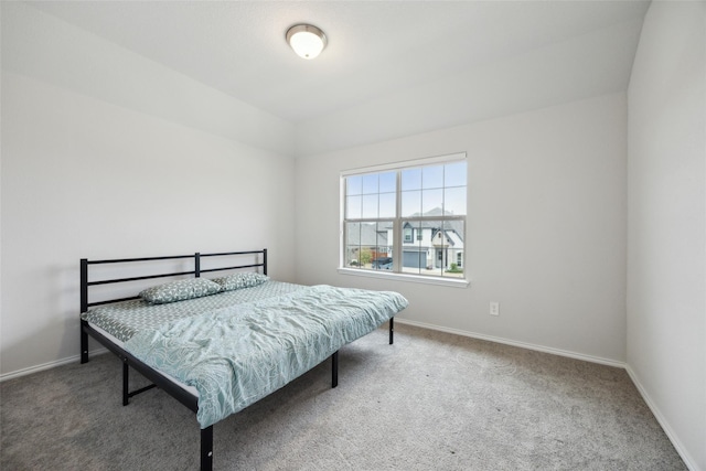 bedroom with carpet flooring and baseboards