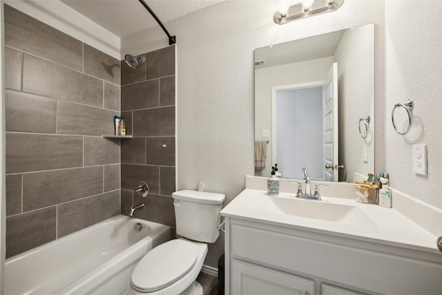 full bathroom featuring vanity, toilet, shower / bath combination, and a textured wall