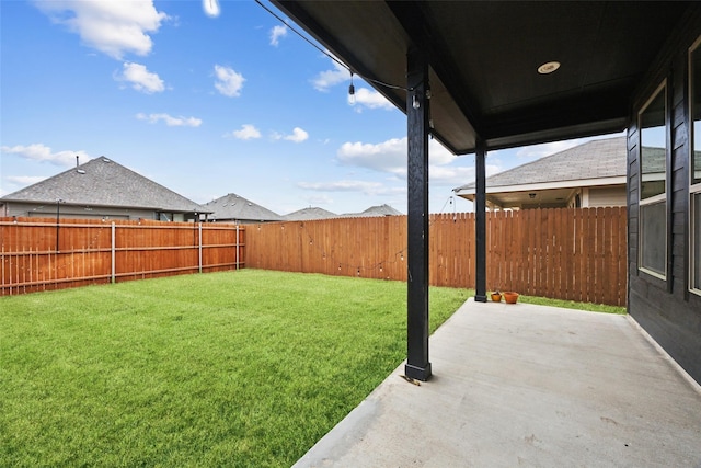 view of yard with a fenced backyard and a patio area