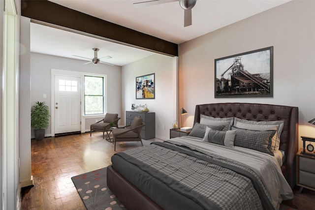 bedroom with beam ceiling, baseboards, a ceiling fan, and wood finished floors