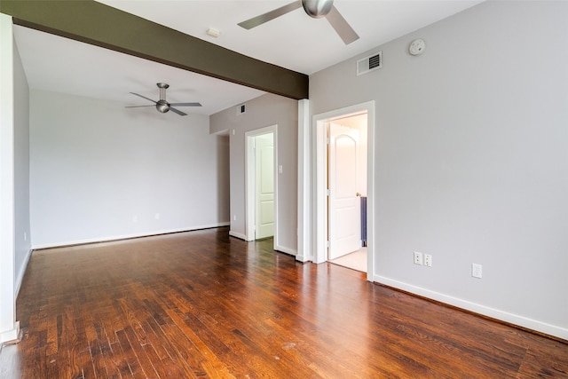 spare room featuring visible vents, wood finished floors, baseboards, and ceiling fan