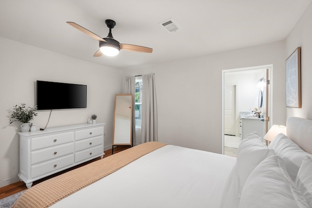 bedroom featuring light wood-type flooring, visible vents, a ceiling fan, and a sink
