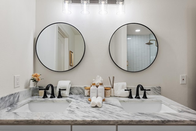full bath featuring a sink and double vanity