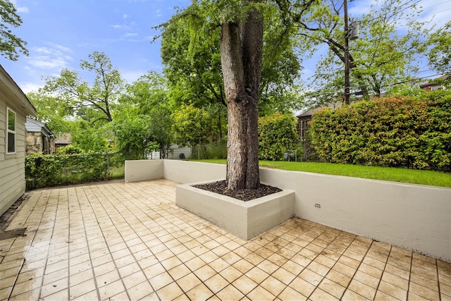 view of patio / terrace featuring fence