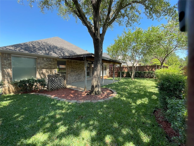 view of yard with a patio area and fence