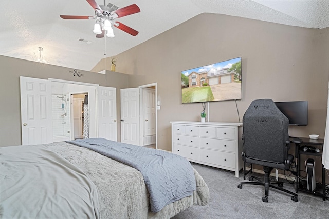 carpeted bedroom with a ceiling fan, visible vents, a textured ceiling, and vaulted ceiling