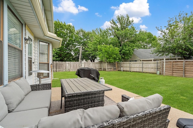 view of patio / terrace with a fenced backyard, grilling area, and an outdoor living space