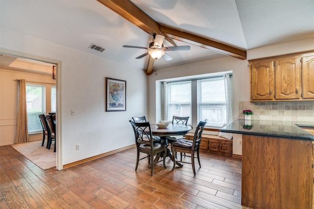 2605 Nighthawk Dr, Plano, TX 75025 - dining room with a ceiling fan, lofted ceiling with beams, visible vents, and wood finished floors
